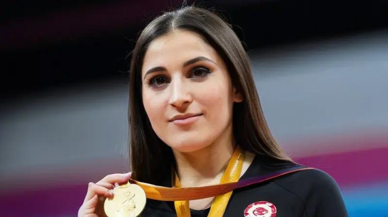 Una joven atleta, Fátima Diame, sostiene una pose victoriosa con su medalla de oro brillante a la vista